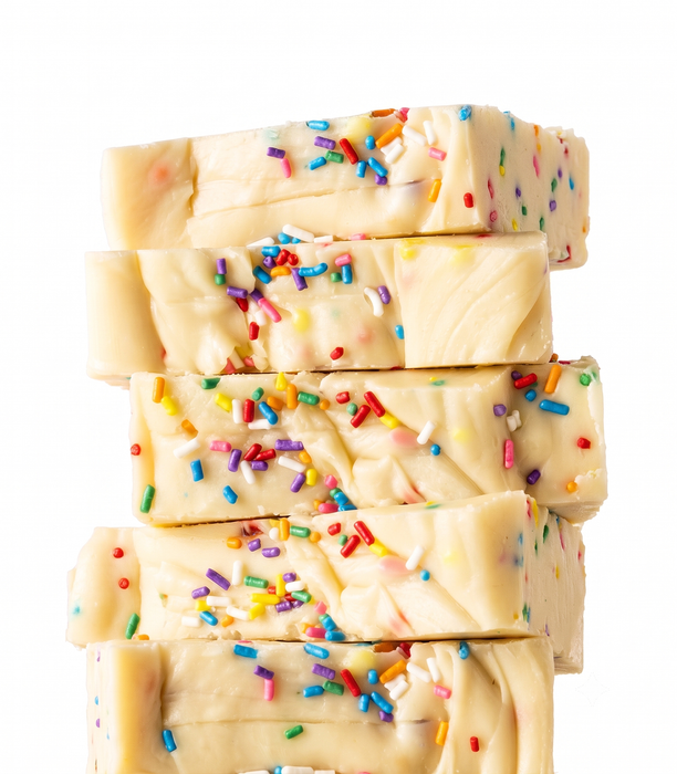 Stack of creamy Birthday Cake Fudge with colorful sprinkles on a white background