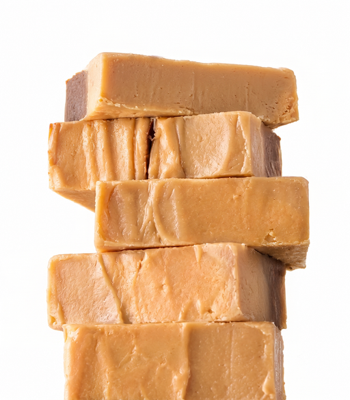 Stack of handmade Chocolate Peanut Butter Fudge on a white background