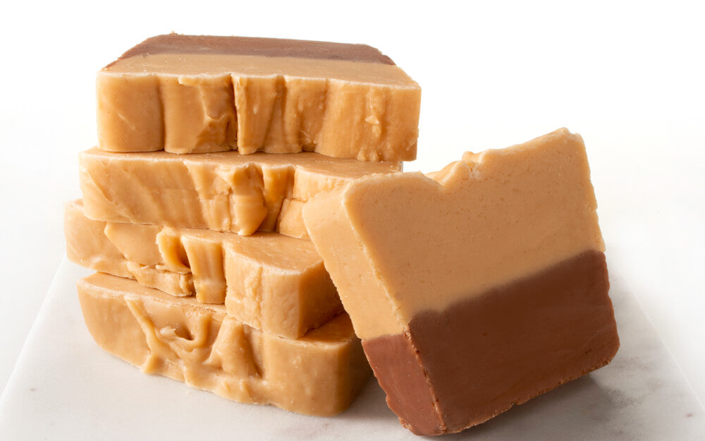 gourmet chocolate peanut butter fudge sliced and stacked